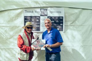 Nigel Matthews (right), Hagerty Collector Car Insurance, presents the 2016 Featured Marque Award to Dennis Brammer from Victoria for his 1962 Daimler SP250, Convertible.