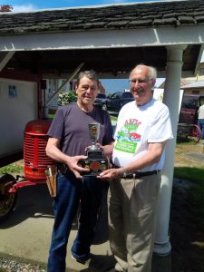 Barry Mason (right) long time friend of the 2016 ABFM Spirit Award winner Gerry Parkhill shares the moment at the Chilliwack Agricultural Museum where Gerry is responsible for acquiring and maintaining many of the exhibits.