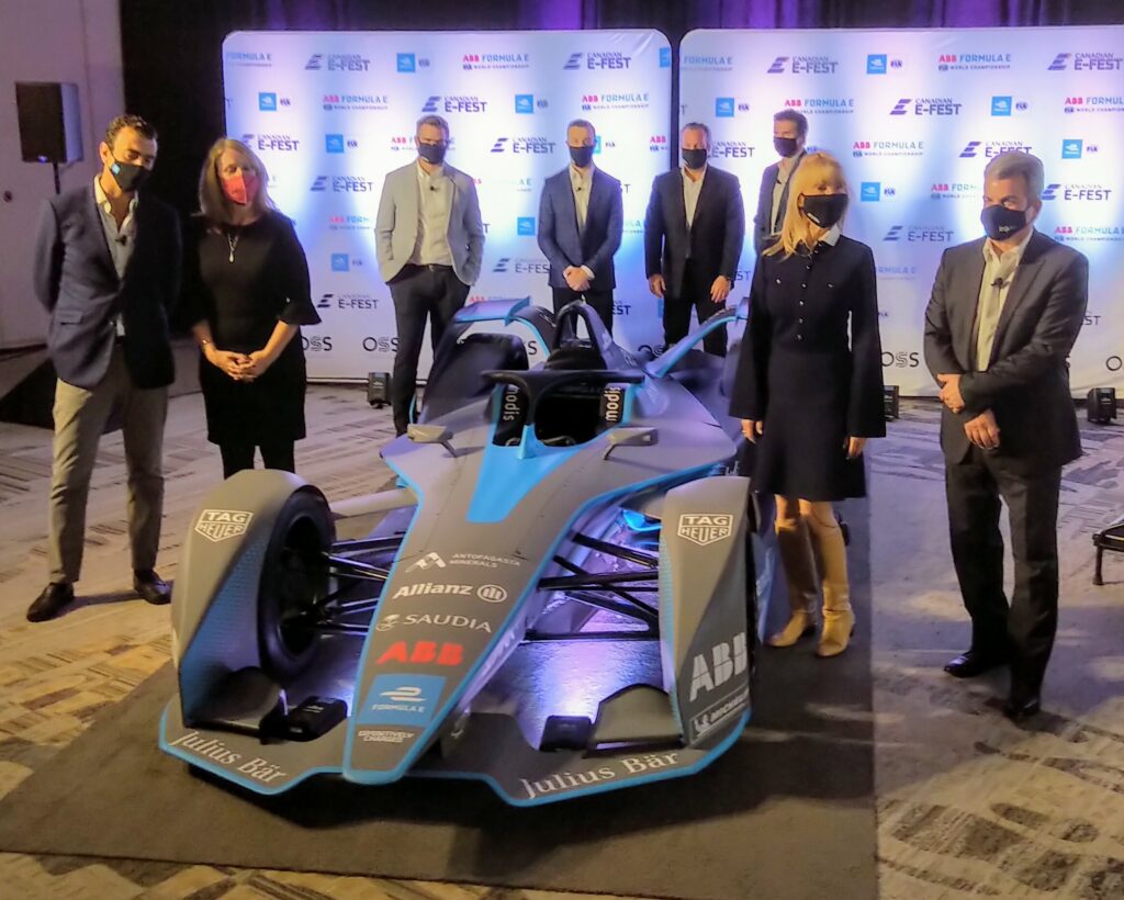 (Front left) Alberto Longo, Formula E's co-founder & chief Championship officer; Sarah Kirby-Young, Vancouver city councillor.

(Front right) Anne Roy, chief marketing officer/partner OSS Group; Matthew Carter, CEO/partner OSS Group.

(Back Row) OSS Group team, including spokesperson and Canadian Indy Car racer James Hinchcliffe (second left). Photo: P. Stewart.
